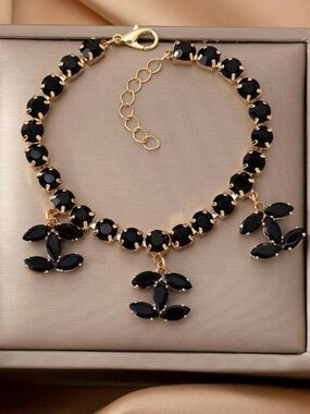 Gold-Plated Bracelet with Black Gem Charms